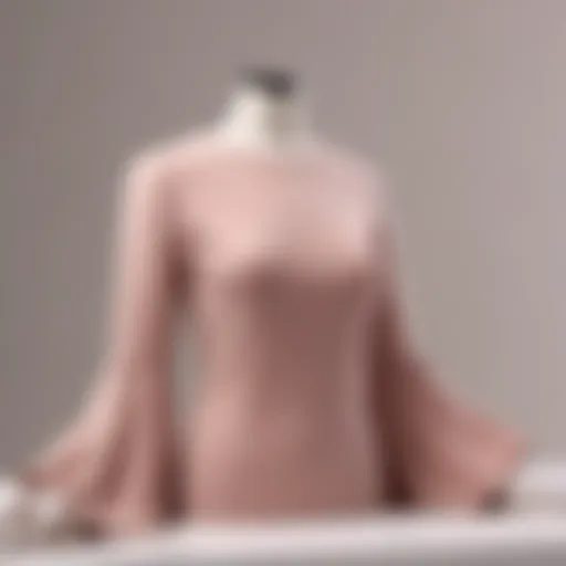 Elegant bell sleeve t-shirt displayed on a mannequin with a minimalist backdrop.