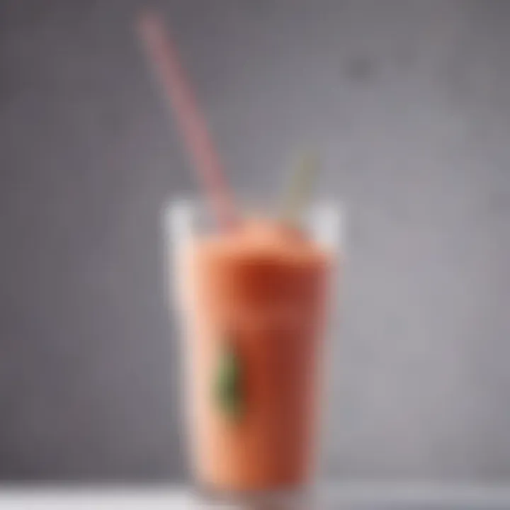 Close-up view of a silicone straw resting on a glass of smoothie