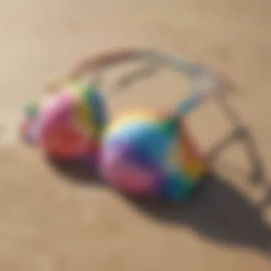 Vibrant tie dye push up bikini displayed on a beach