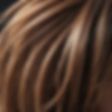 Close-up of hair strands being straightened and combed